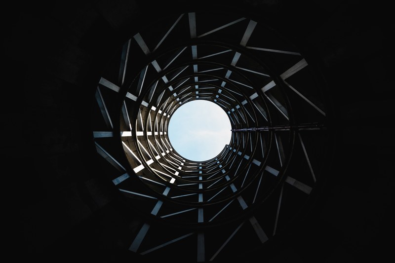 view from the bottom of a deep well on the blue sky above, friends in unfamiliar places 4k