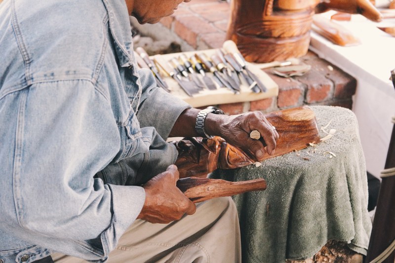 weathered hands of the skilled tiki carver 4k