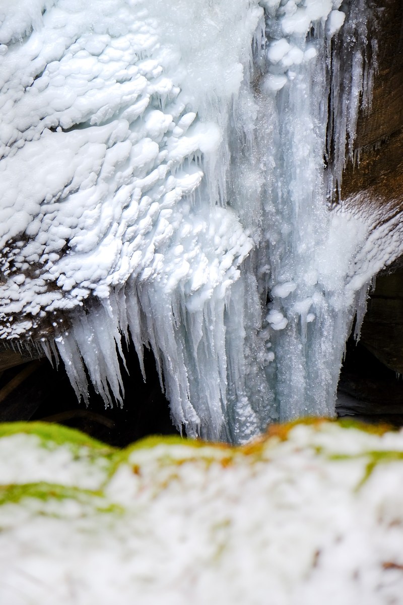 massive icicles hang overlooking the canyon 4k