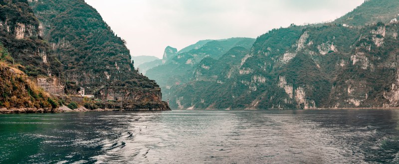 a river flowing in a deep gorge near three gorges dam, a view of yangtze river china 4k