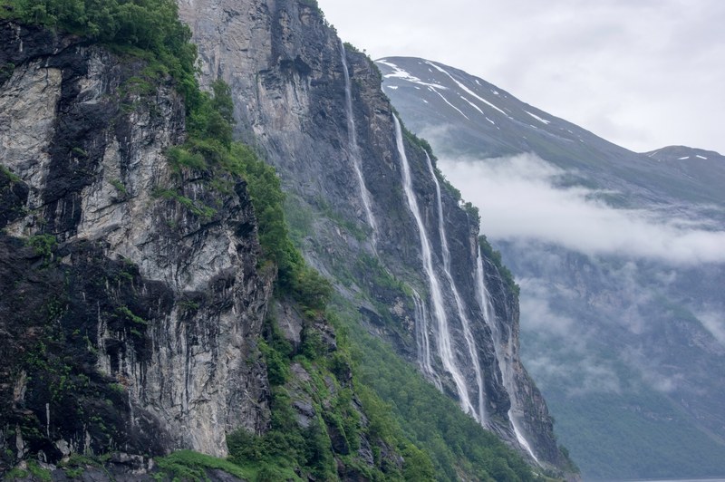 mountainsides with waterfalls and lush greenery in geirangerfjord, gorgeous geirangerfjord 4k