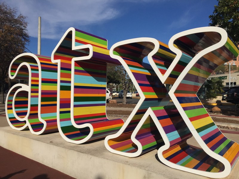 atx sign next to whole foods market 4k
