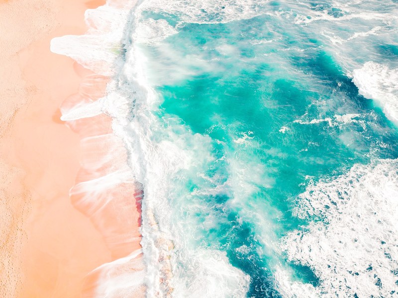 drone view of rough ocean washing on sand shore in california, montara beach california 4k