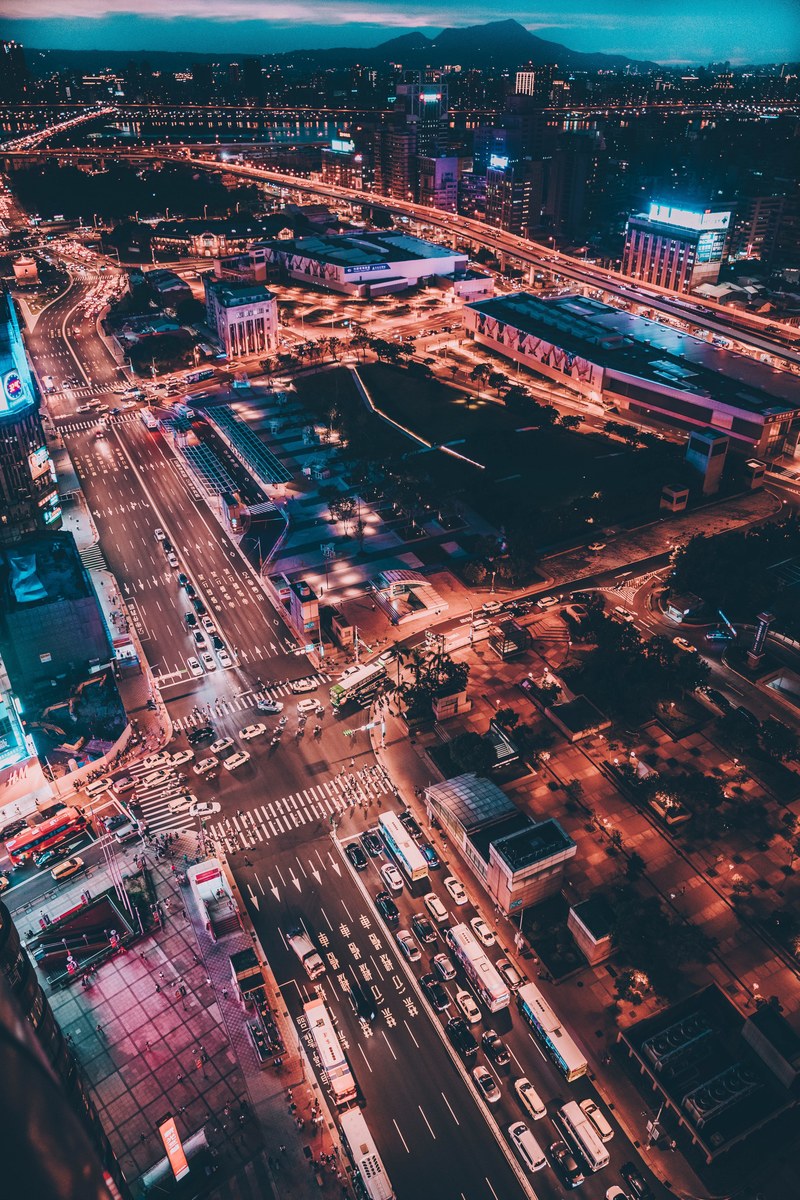 drone view of a well lit and busy metropolitan city, _taipei main station 4k