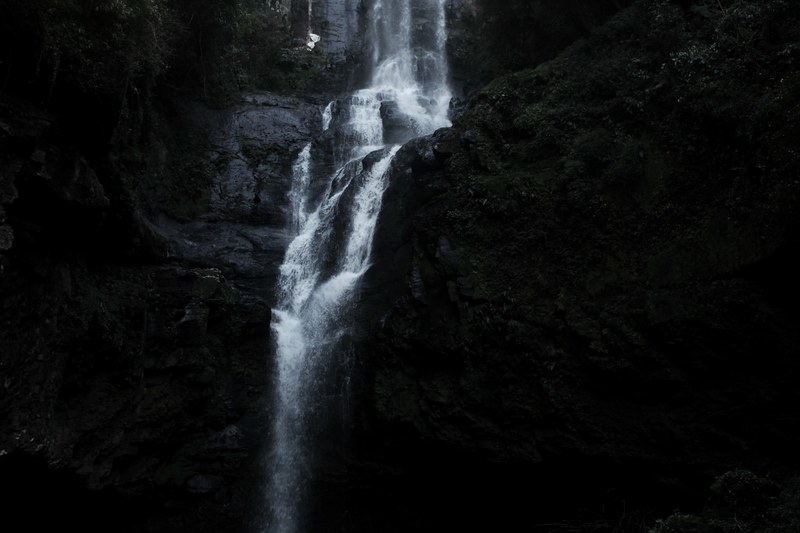 large waterfall tumbling down a rock cliff seen through a dark filter, one of the 8 water falls 4k