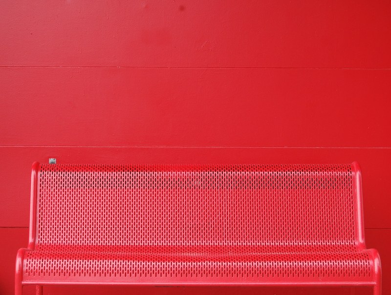 a red colored steel bench is attached to a red wall in columbus, _red bench wall columbus 4k