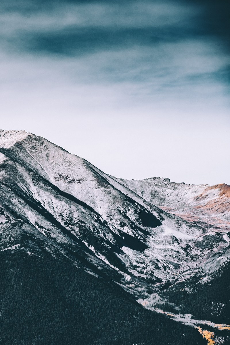 snowy mountain landscape under a cloudy sky, snow on mountains 4k