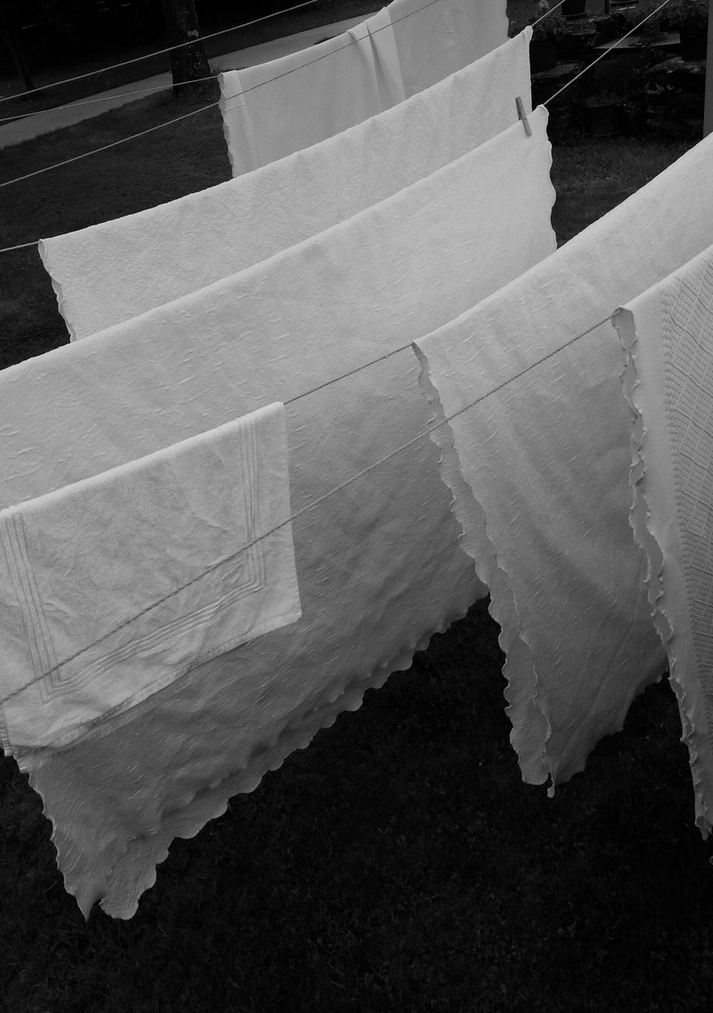 towels being hung out to dry on a clothes line in a ra, laundry 4k