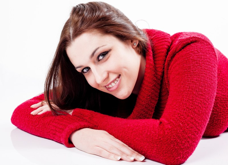 young woman female smiling lying down jumper red 4k