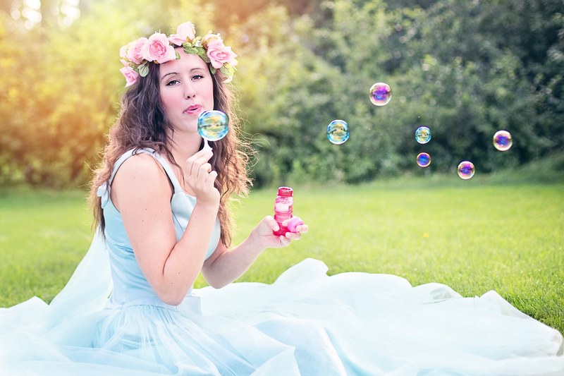 woman blowing bubbles young sitting beauty summer 4k