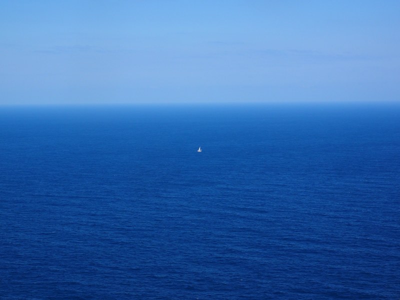 sea ocean wide blue water sailing boat lonely 4k
