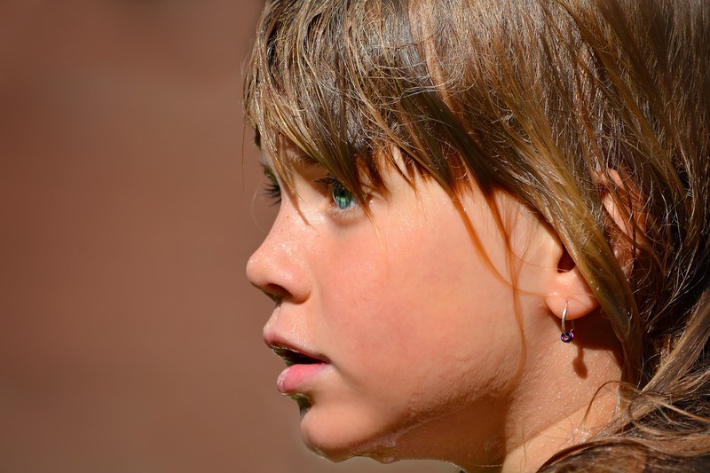 person human child girl face wet close 4k