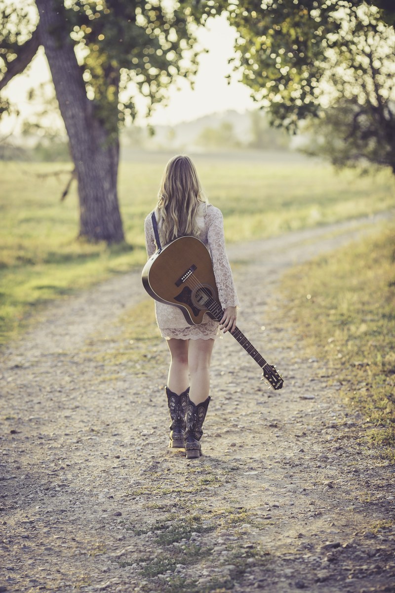 guitar country road young female musician outdoor 4k