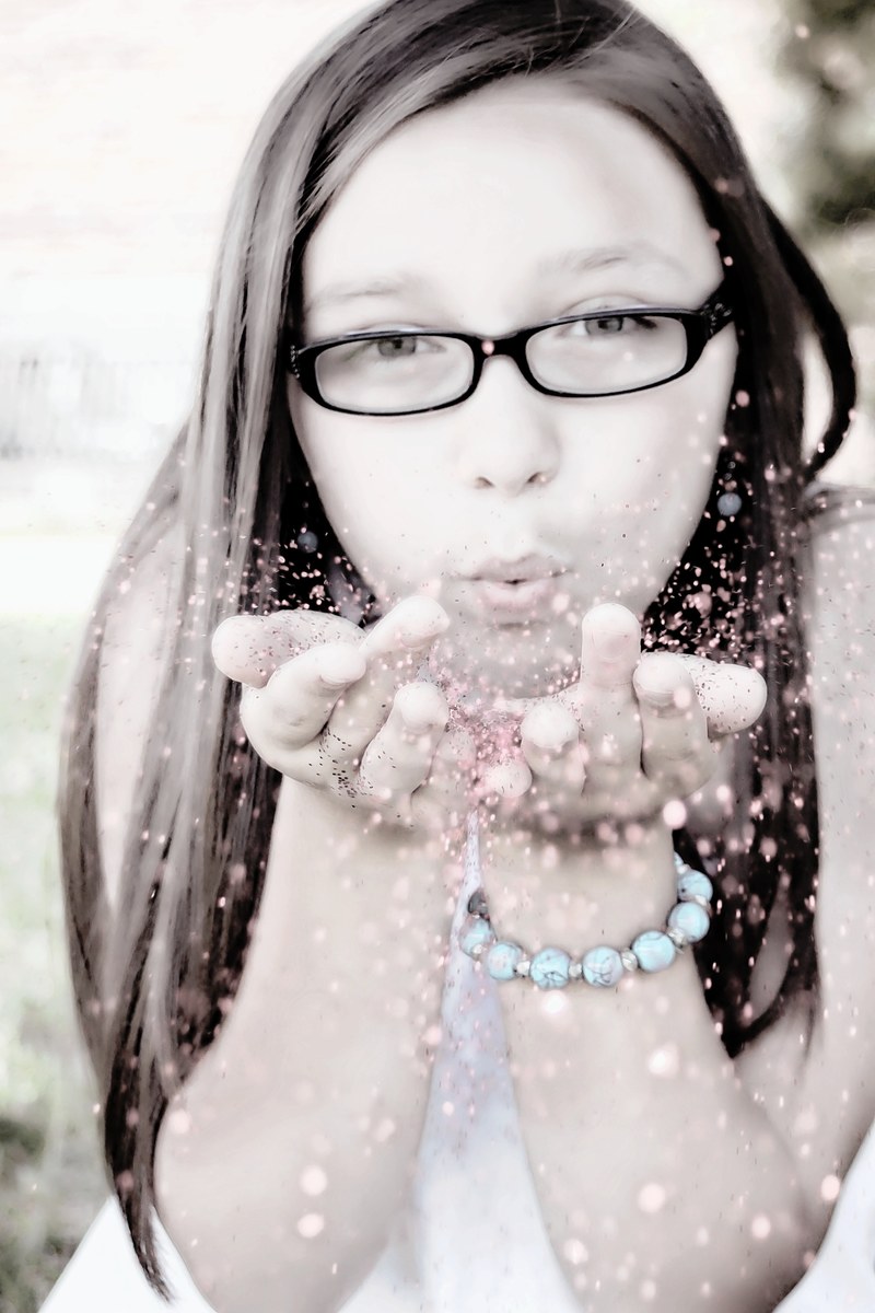 girl blowing glitter face portrait fun low color 4k