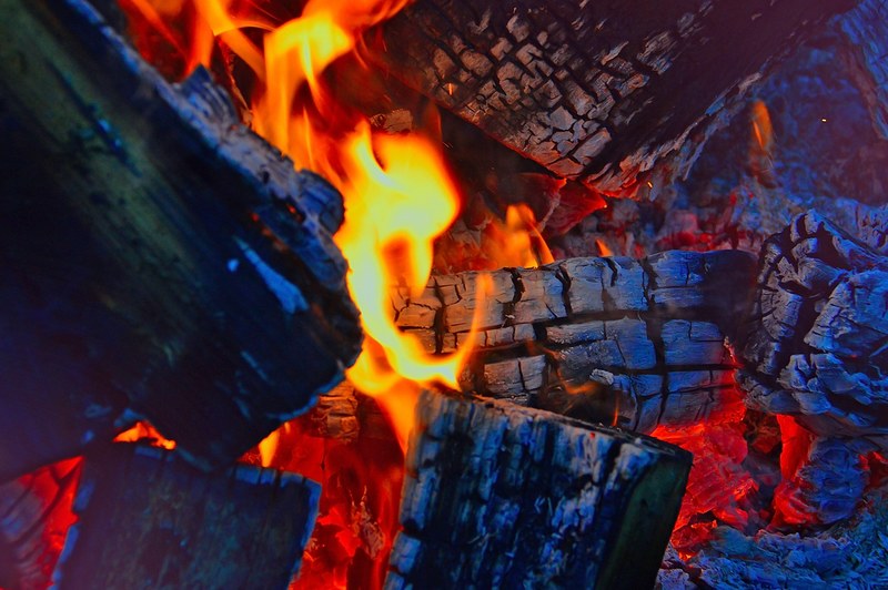 fire campfire burns flame flames at night red 4k