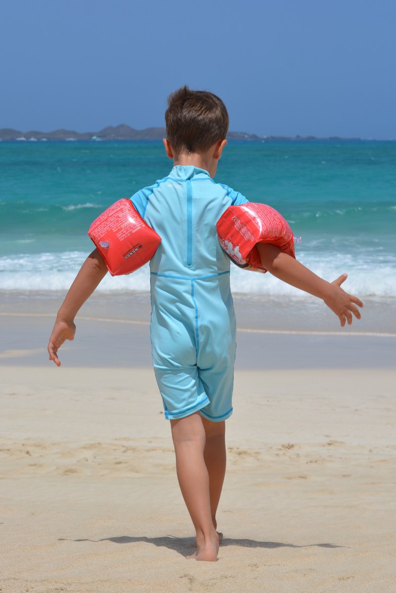 boy beach sea rubber rings uv suit child people 4k