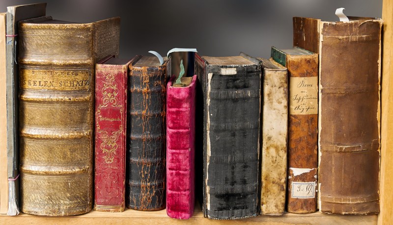book read old literature pages books bookshelf 4k
