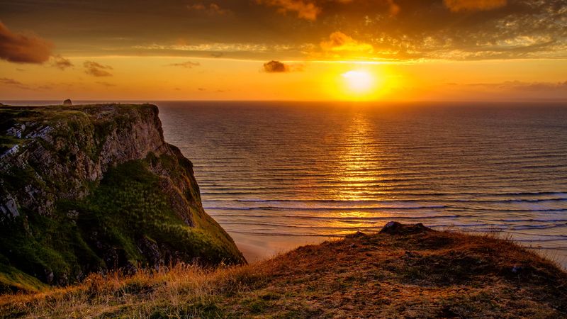 sunset, horizon, rock, water surface, grass, 4k