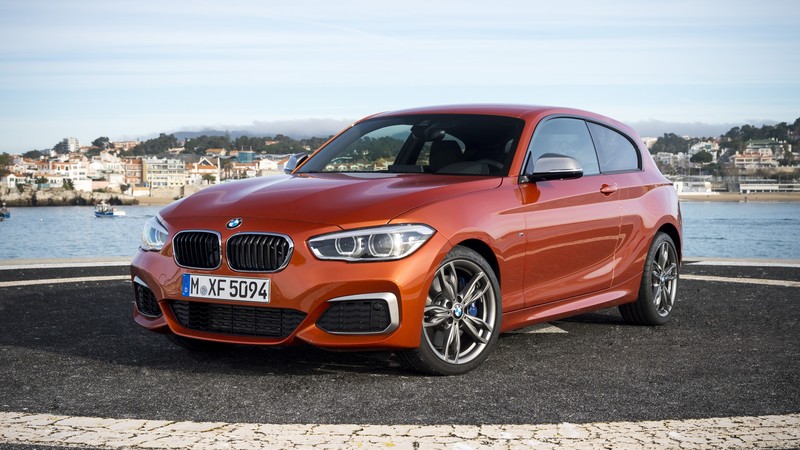 BMW M135, hatchback, orange.