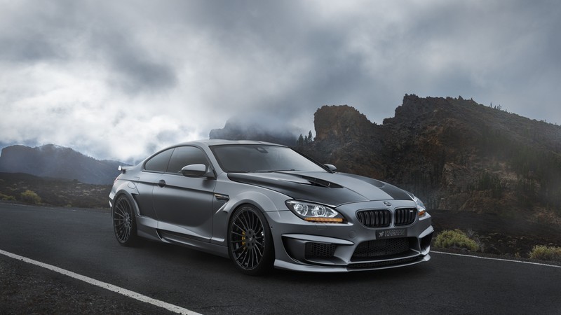 BMW M6, hatchback, gray, rocks.