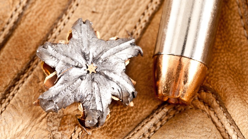 bullet, close up, mushroom bullet, open point, dumdum, discharged bullet, leather