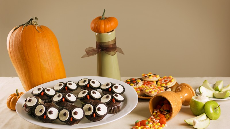 Halloween, All Hallows Eve, All Saints Eve, holiday table, candy, muffins, apple, pumpkin