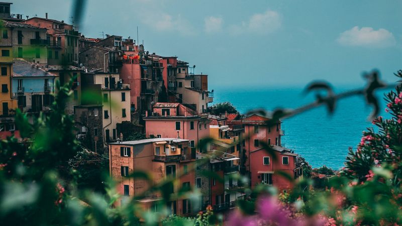 city, buildings, flowers, sea, italy, 4k