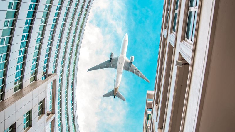buildings, plane, sky, clouds, bottom view, 4k