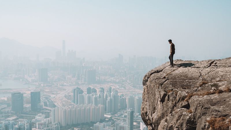 cliff, man, city, aerial view, height, loneliness, 4k