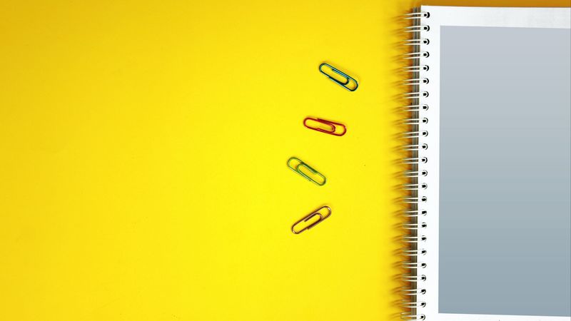 notebook, paper clips, surface, yellow, 4k