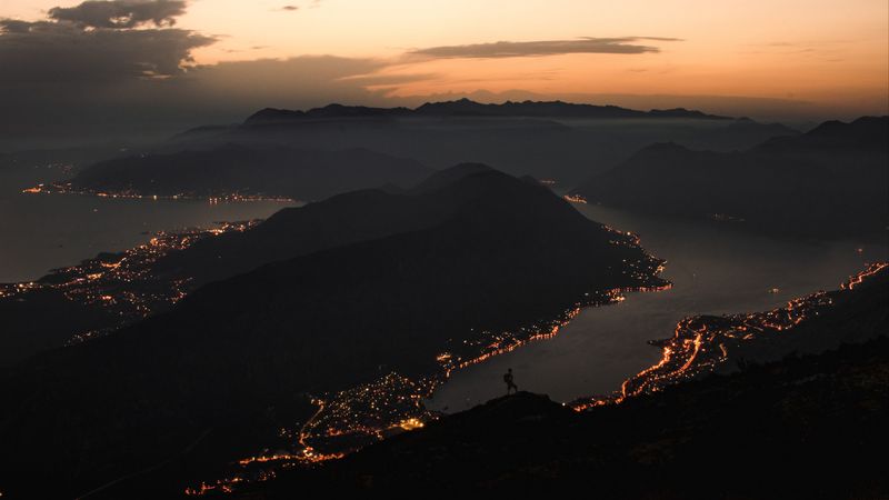 mountains, coast, aerial view, city, night, lights, 4k