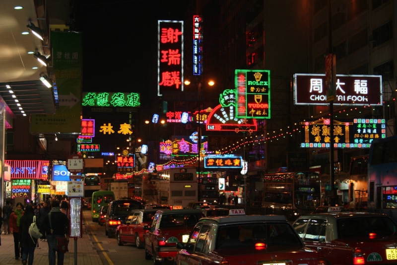 street, built structure, motor vehicle, group of people, city street, lights, people, land vehicle, vehicles, advertisement, side, text, Asia, building exterior