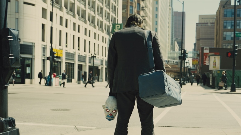 bag, city, day, city life, movies, adult, one person, architecture, 1080P, three quarter length, outdoors, lifestyles, focus on foreground, suit, Joker