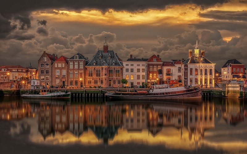 moored, built structure, nautical vessel, transportation, building exterior, port, cloud - sky, mode of transportation, no people, laptop, sailboat