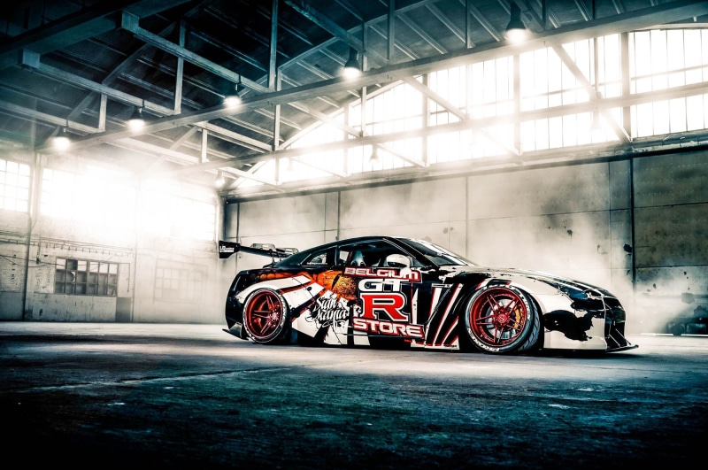 Nissan Skyline GT-R, competition, illuminated, day, stationary, mode of transportation, land vehicle, Nissan GTR, transportation, sport, inside, architecture