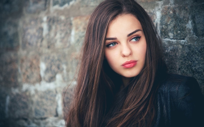 blue eyes, young adult, hair, lipstick, brick, wall, women, teenager, hairstyle, adult, looking at camera, wall - building feature, beauty, beautiful woman