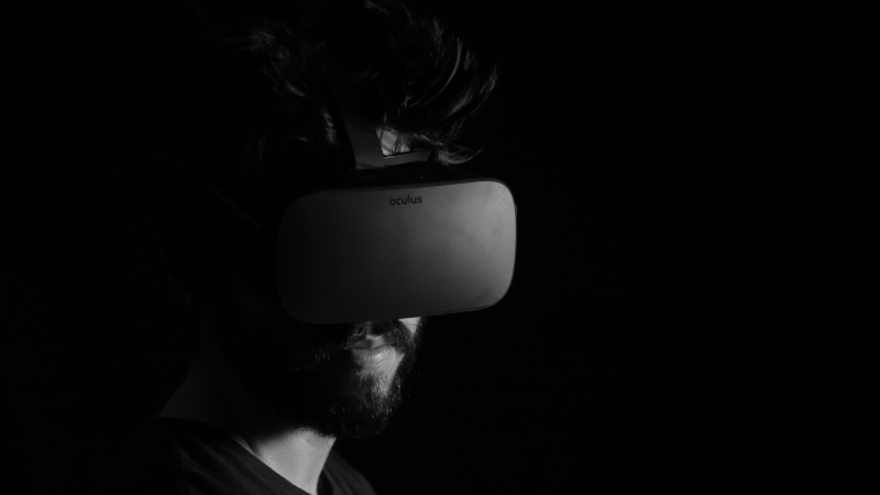 reality, facial hair, game, human face, virtual reality, copy space, front view, 4K, hairstyle, technology, one person, black background, grayscale, indoors