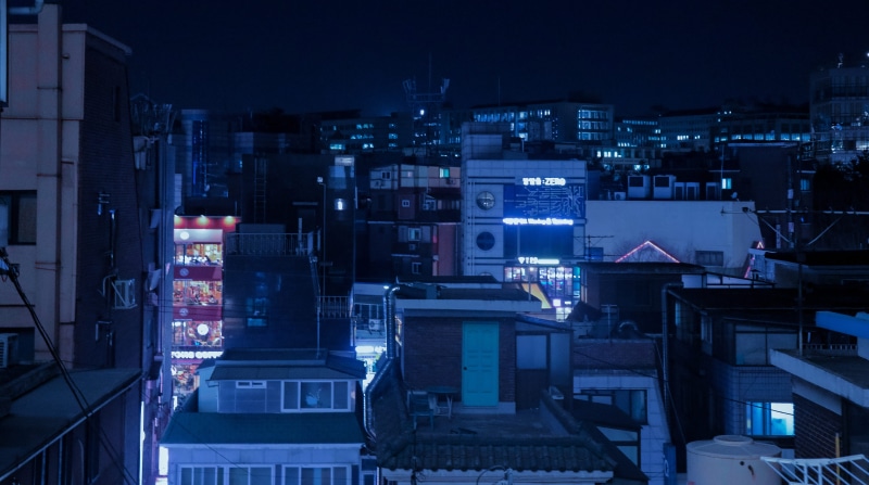scenery, cyberpunk, glowing, night, high angle view, 5K, neighborhood, architecture, nightlife, building exterior, high rise, cityscape, office building exterior