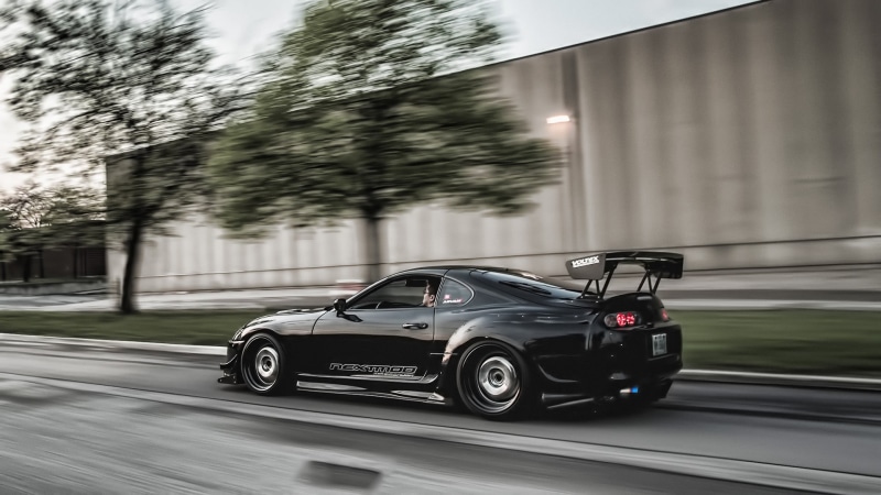 silver colored, tuning, built structure, car, speed, architecture, road, street, mode of transportation, building exterior, land vehicle, on the move, JDM