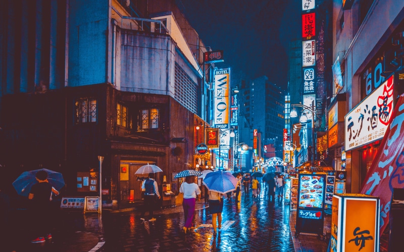 street photography, architecture, transportation, dusk, rain, city life, neon, 5K, night, building, street, walking, building exterior, shop, city street