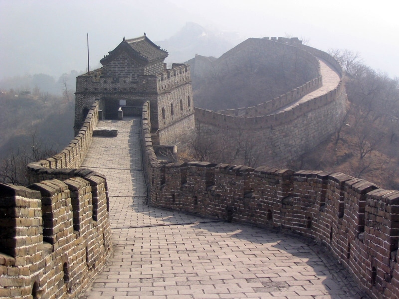 the past, sofa, old, built structure, ancient civilization, mountain, stone wall, fort, outdoors, day, building, travel, tourism, fog, nature, Great Wall of China