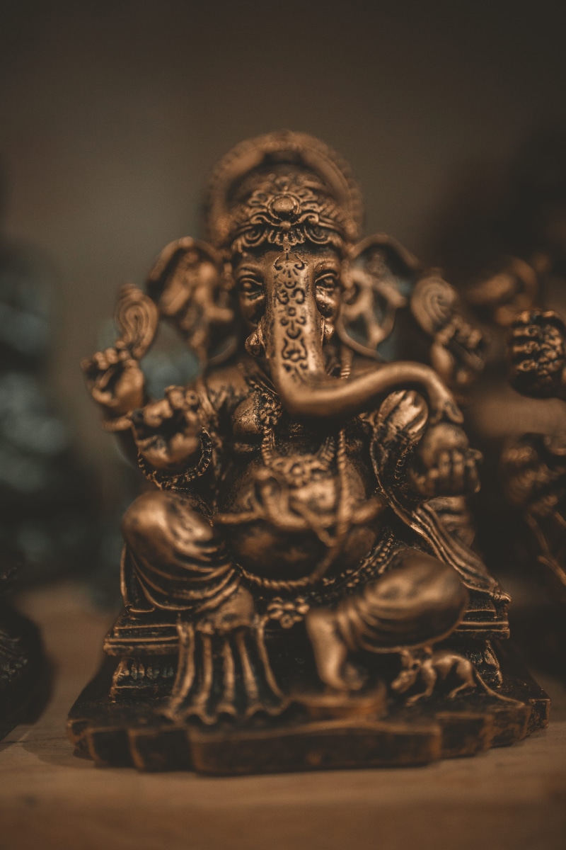 statue, culture, male likeness, brass, god, human representation, representation, selective focus, idol, indoors, symbol, belief, worship, art and craft