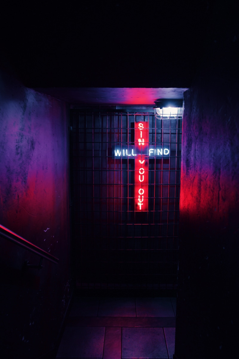 entrance, cross, interior design, lighting equipment, red, spooky, built structure, nightlife, flare, indoors, dungeon, architecture, basement, gate, building exterior