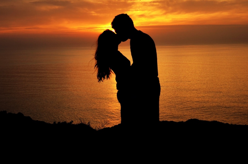 happiness, sunset, romance, two People, tranquil Scene, leisure activity, black Color, sun, one Person, bonding, nature, sea, orange Color, vacations, honeymoon