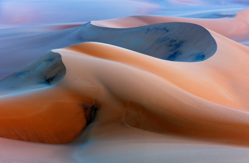 sky, desert, Sand Dunes, tranquility, tranquil scene, beauty in nature, land, sand, landscape, geology, outdoors, eroded, mountain, arid climate, scenics - nature