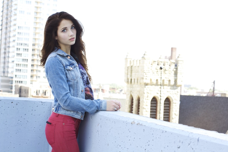 hairstyle, looking at viewer, casual clothing, s, women, built structure, model, women outdoors, building exterior, 5K, adult, denim, jacket, balcony