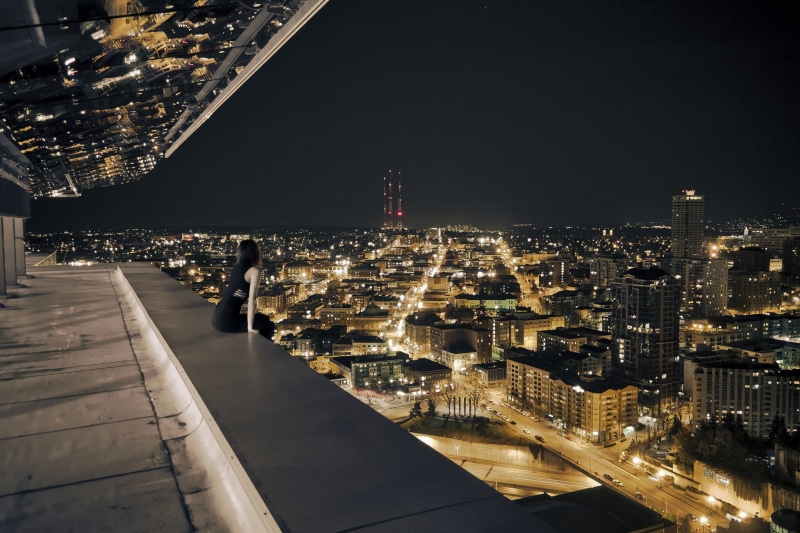 building exterior, black, built structure, financial district, night, balcony, sitting, skyscraper, rooftops, city, s, high angle view, 1080P, women, building