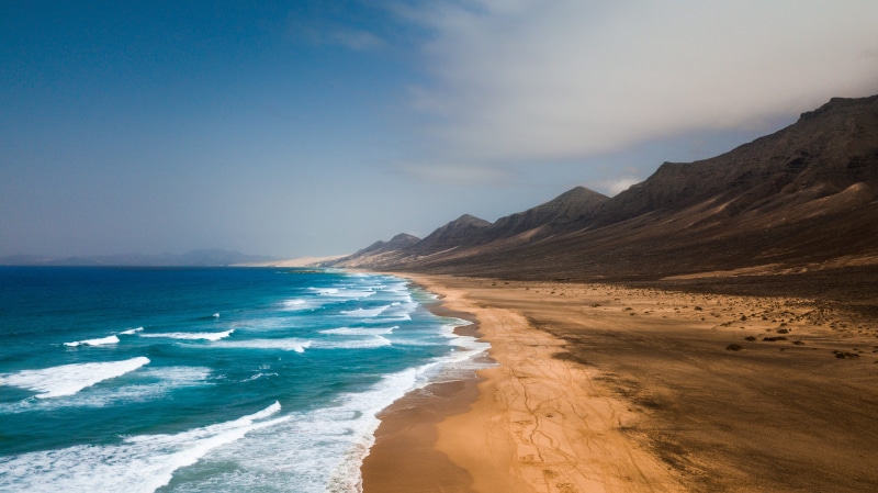 ocean, day, idyllic, sea waves, beside, outdoors, nature, 4K, spain, scenery, beach, land, promontory, tranquil scene, mountain, water, non-urban scene