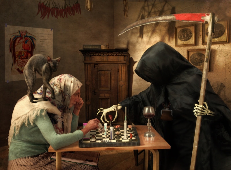 representation, sculpture, cat, playing, activity, wood - material, board game, social issues, game, leisure games, woman, one person, old people