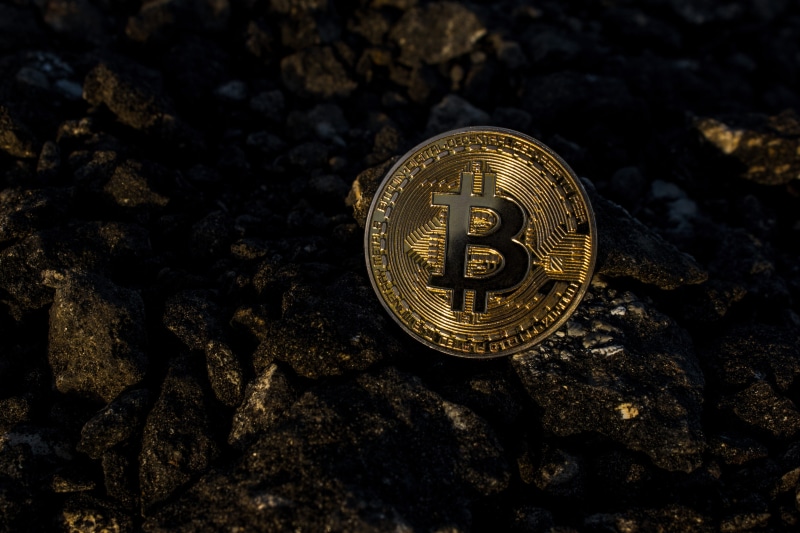 no people, western script, pavement, solid, rock - object, money, crypto, government, bitcoin, coin, economy, gold colored, text, monetary, close-up, military